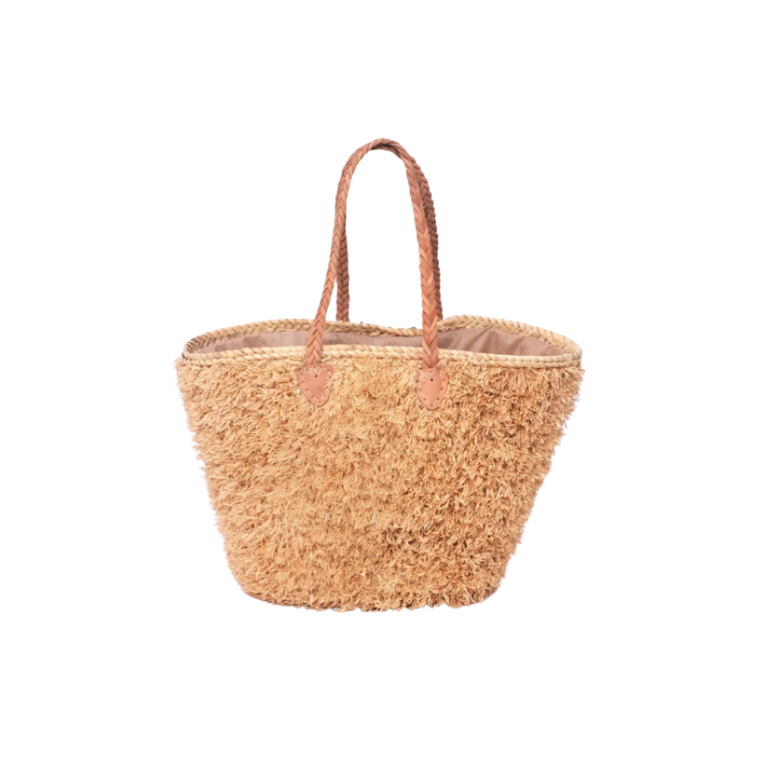 Beige, handgefertigte Basttasche aus Rafia mit shaggy Oberfläche und geflochtenen Lederhenkeln