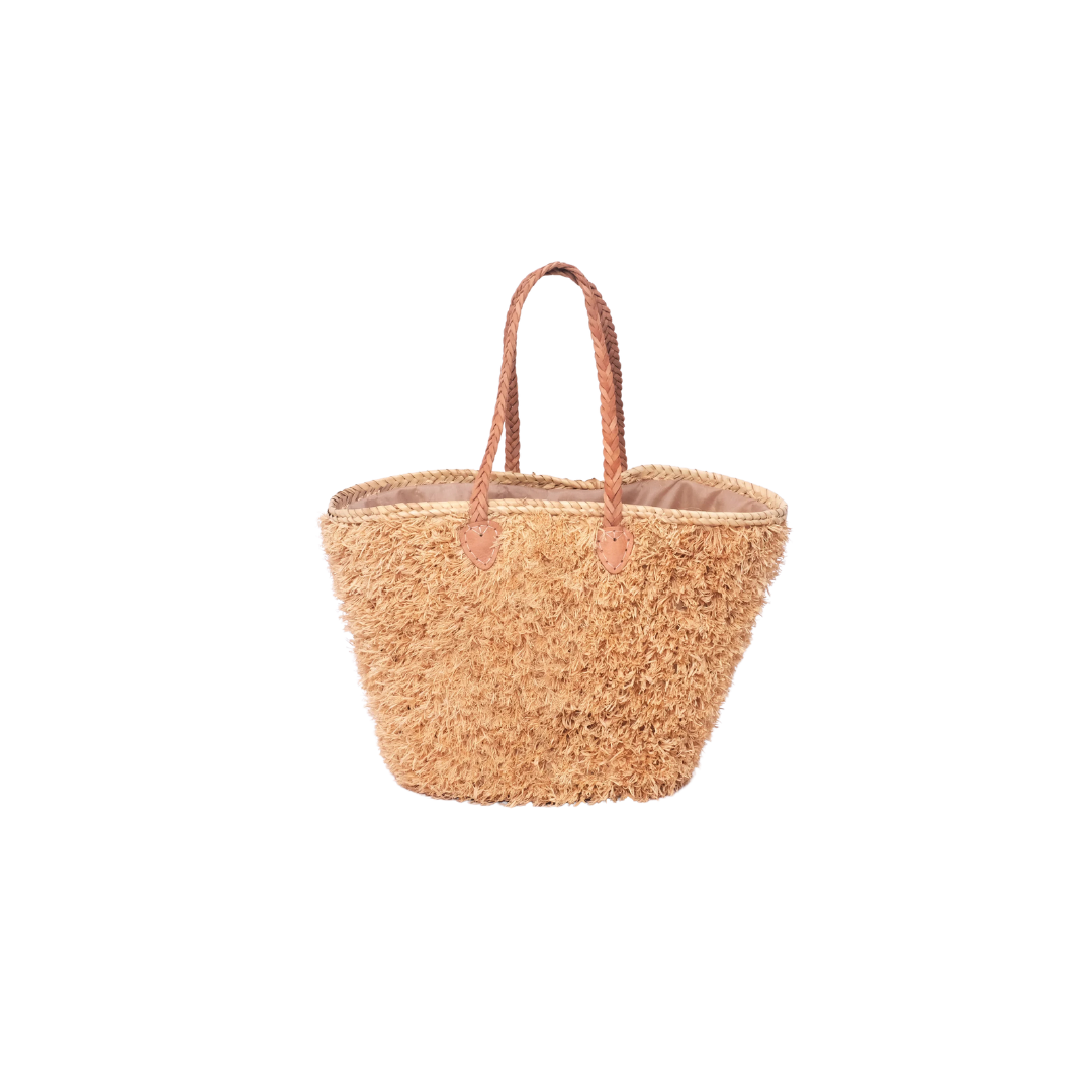 Beige, handgefertigte Basttasche aus Rafia mit shaggy Oberfläche und geflochtenen Lederhenkeln