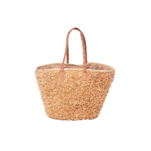 Beige, handgefertigte Basttasche aus Rafia mit shaggy Oberfläche und geflochtenen Lederhenkeln