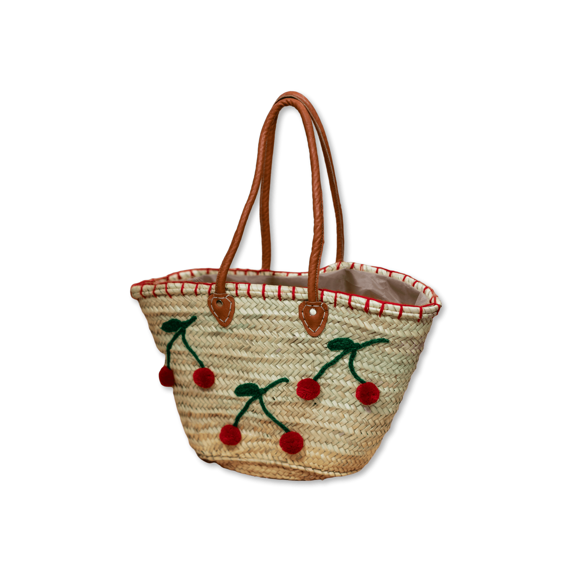 Handgewebte Basttasche aus Naturstroh mit grünen Garnstielen und roten Pompon-Kirschen sowie braunen Lederhenkeln